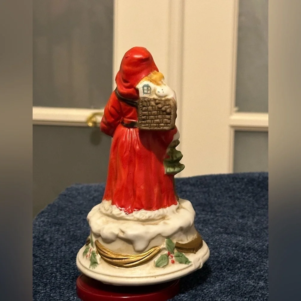 Revolving porcelain Santa musical figure plays Santa Claus is Coming to Town.